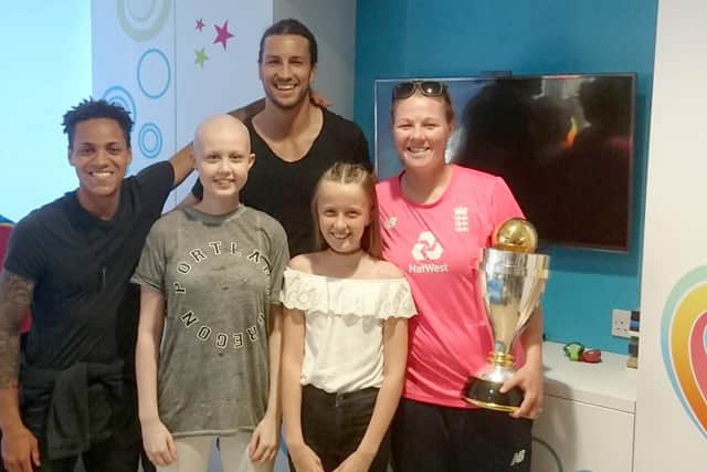 Beth Tiller (middle left) and her sister Charlotte at Southampton General Hospital in July 2017 during the visits of Pompey players Kyle Bennett and Christian Burgess, and women's cricketer Anya Shrubshole