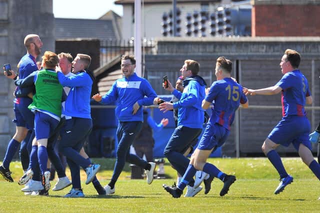 Tom Jeffes, far left, is mobbed after scoring US Portsmouth's penalty winner against former club Christchurch. Pic: Martyn White.