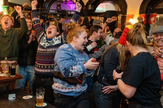 England fans celebrating Harry Kane's penalty at The Kings in Southsea. Picture: Matthew Clark