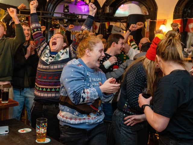 England fans celebrating Harry Kane's penalty at The Kings in Southsea. Picture: Matthew Clark
