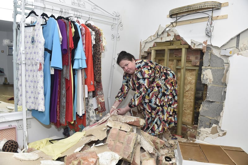Damage to Voluptuous Vintage shop and a residential property next door in Village Road, Alverstoke, where a two-car collision took place and three people have been arrested.

Pictured is: Owner of Voluptuous Vintage in Village Road, Alverstoke, Jennifer Darling (47).

Picture: Sarah Standing (110124-4626)