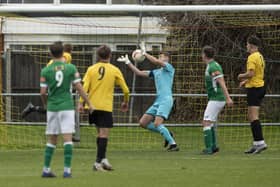 Lewis Jenkins (partly hidden) heads Littlehampton into a 2-0 lead against Moneyfields in the  FA Vase. Picture: Chris Hatton
