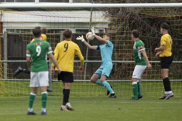 Lewis Jenkins (partly hidden) heads Littlehampton into a 2-0 lead against Moneyfields in the FA Vase. Picture: Chris Hatton