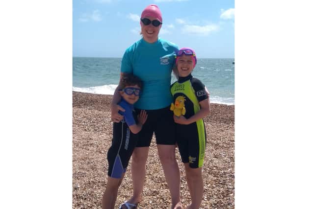 Lucy Burton from Portsmouth, who swam the distance of the English Channel - 32km - to raise money for childrens hospice Chestnut Tree House, with her children Edgar and Clara
