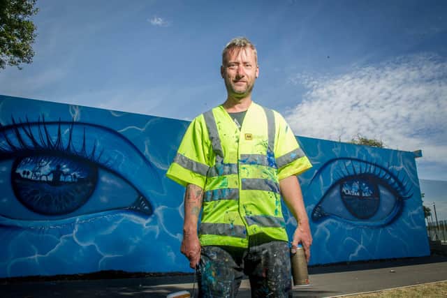 My Dog Sighs with his mural at Hilsea Lido last July.