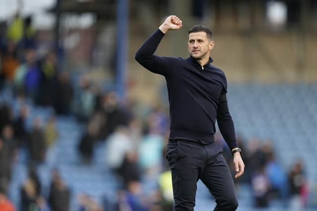 Pompey head coach John Mousinho celebrates the win over Carlisle today. Pic: Jason Brown.