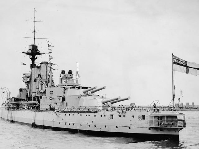 The Royal Navy King George V-class dreadnought battleship HMS Centurion, flagship of the Reserve Fleet Portsmouth at anchor off Spithead awaiting the Fleet Review by King George V on 26 July 1924 off Portsmouth, United Kingdom. HMS Centurion was scuttled as a breakwater during the Invasion of Normandy off Omaha Beach on 9 June 1944 to protect a Mulberry harbour built to supply the forces ashore. (Photo by Topical Press Agency/Hulton Archive/Getty Images)