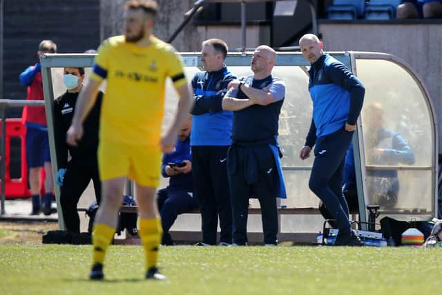 Coach Paul Barton (far right) pictured with USP boss Glenn Turnbull (centre) and assistant boss Fraser Quirke during the FA Vase fourth round victory over Christchurch last month. Picture: Chris Moorhouse.