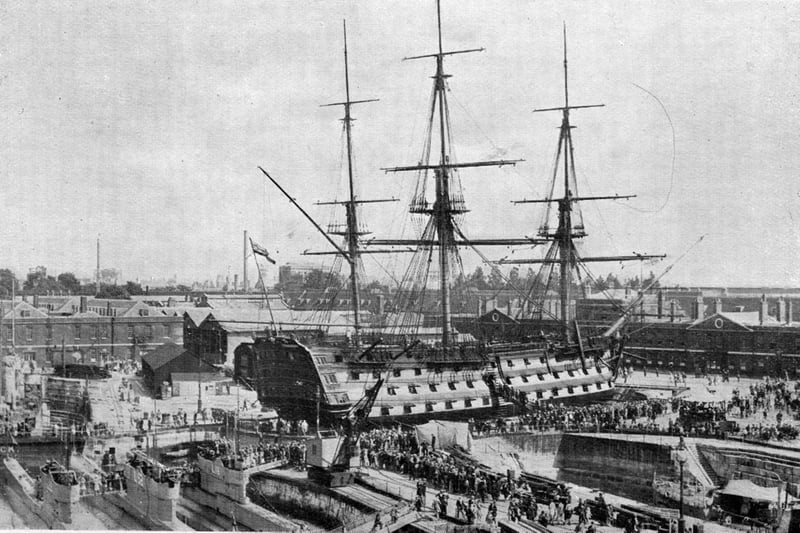 In days past when we had a huge navy, HMS Victory was titled ’the cathedral of the Royal Navy. In this magnificent photograph, thousands of  people can be seen 
trying to  board the nelson’s flagship. Where the Mary Rose museum now stands can be seen sheds and warehouses. Undated