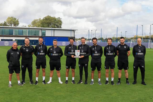 Danny Cowley and some of his coaching staff with the award. Pic: Portsmouth FC