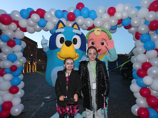 Starr Rance, 5, and Delilah Rance, 9, right, with characters from Over The Rainbow. Starlit Walk in aid of Rowans Hospice, Portsmouth Historic Dockyard, HM Naval Base PortsmouthPicture: Chris Moorhouse (jpns 261023-15)
