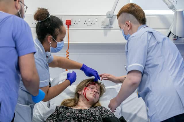 Nurses and doctors treating a casualty at the makeshift hospital at St Andrews Court, Portsmouth
Picture: Habibur Rahman