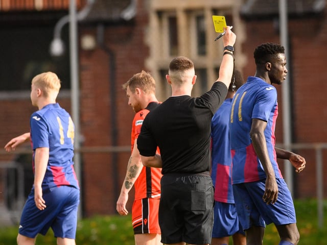 Lamin Jatta is booked. Picture: Keith Woodland