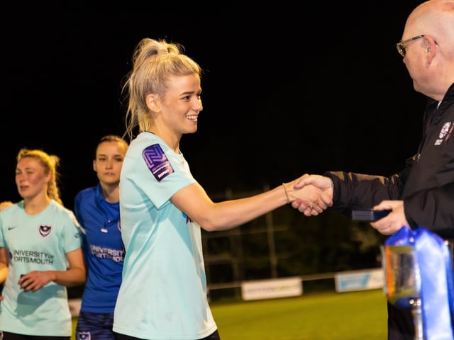 Portsmouth players receive their winners medals. Picture by Alex Shute