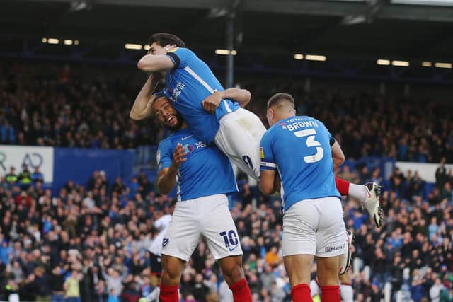 John Marquis puts his hands over his ears while celebrating his Pompey matchwinner against Bolton on Saturday. Picture: Joe Pepler