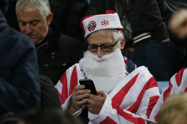 A Sheffield United fan dressed as Father Christmas at Villa Park: Simon Bellis/Sportimage