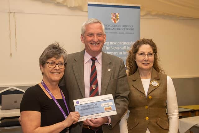 Fiona McCrae (left) of Fareham Monday Club with cheque. Photo by Alex Shute