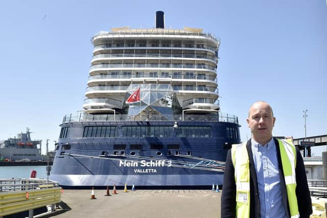 Pictured is: Mike Sellers, port director at Portsmouth International Port, in front of Mein Schiff 3. Picture: Sarah Standing (260523-4555)