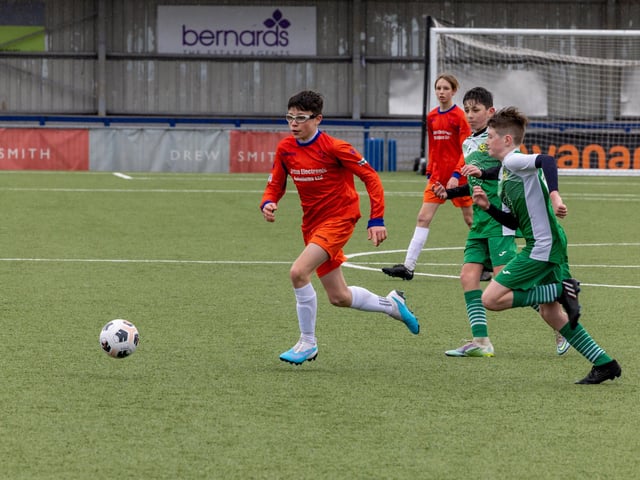 Action from the Under-13 Truman Challenge Cup final between Denmead Youth Lions (orange shirts) and Moneyfields Youth Yellow. Picture: Mike Cooter