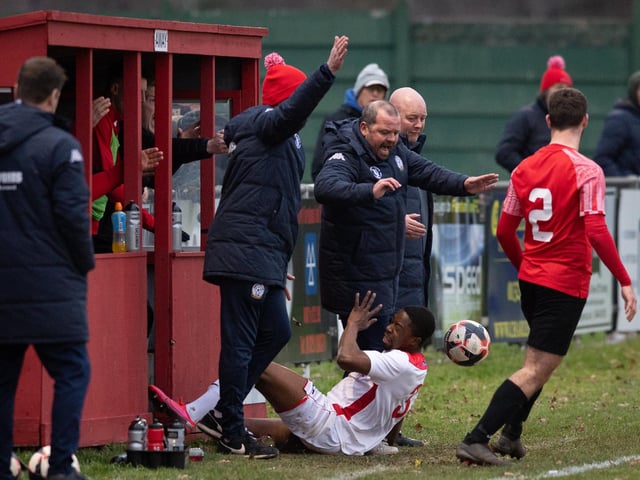 Horndean'sr Fuzz Kanjanda collides with his manager Michael Birmingham. Picture: Keith Woodland