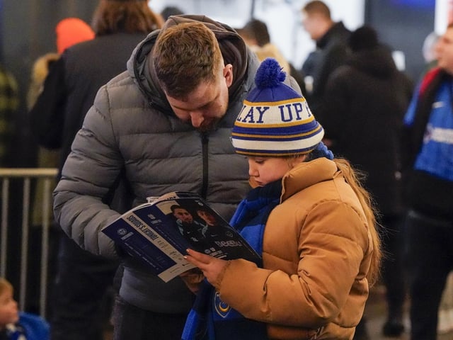 Pompey fans backed their team to a crucial Championship survival win over Cardiff last night.