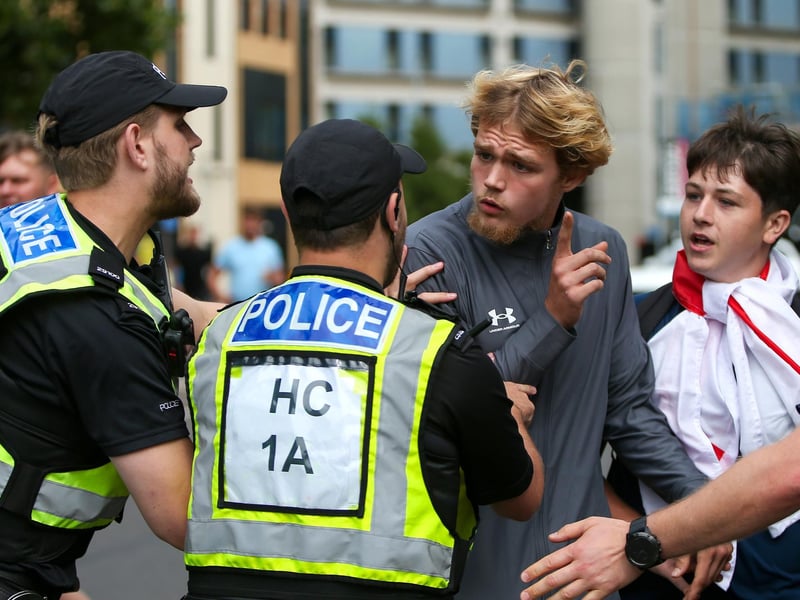 Protestors at Guildhall Square, Portsmouth. Demonstrators having verbal exchanges with officers. Picture: Chris  Moorhouse (030824-51)