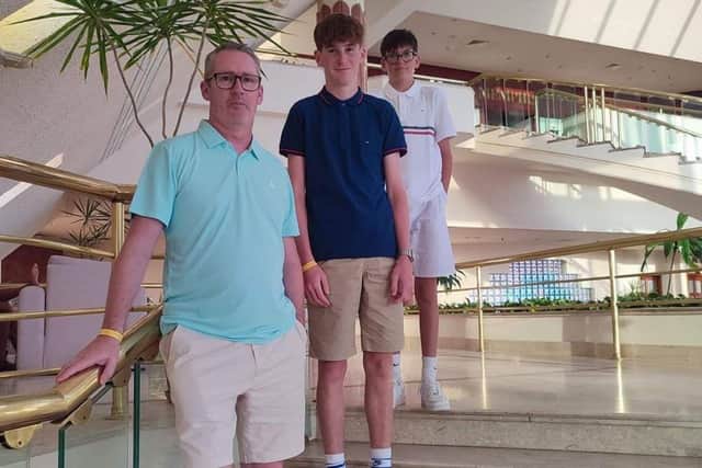 Mr O’Donnell had to be rushed to hospital and be put on an IV drip five times. Picture: Mr O'Donnell alongside his children Niall and Hayden.