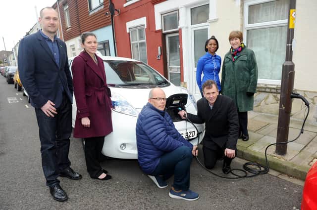 The installation of Portsmouth's first on-street electric vehicle charge point took place in March 2019 in Adair Road, Southsea. Pictured is: (l-r) James Everley, business development director at Ubitricity, Hayley Chivers, strategic transport planner for Portsmouth City Council, electric car owners Glen Arnold and Colin Martin, Alexie Stone-Peters, Smart City solutions development manager and Cllr. Lynne Stagg, cabinet member for traffic and transport. Picture: Sarah Standing (080319-1453)