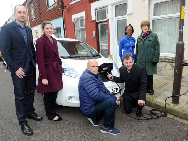 The installation of Portsmouth's first on-street electric vehicle charge point took place in March 2019 in Adair Road, Southsea. Pictured is: (l-r) James Everley, business development director at Ubitricity, Hayley Chivers, strategic transport planner for Portsmouth City Council, electric car owners Glen Arnold and Colin Martin, Alexie Stone-Peters, Smart City solutions development manager and Cllr. Lynne Stagg, cabinet member for traffic and transport. Picture: Sarah Standing (080319-1453)