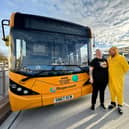 Rachel Street and Graeme Clark, bus drivers, in front of the 'Pudsey' bus