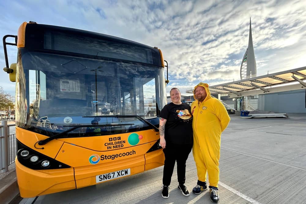 Rachel Street and Graeme Clark, bus drivers, in front of the 'Pudsey' bus