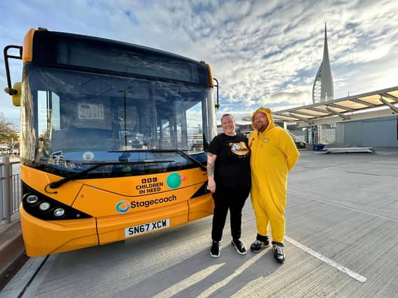 Rachel Street and Graeme Clark, bus drivers, in front of the 'Pudsey' bus