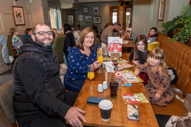 Family day out for the opening of the Brewers Fayre. Pictured: Richard John (42), Peggy Mitchell (62), Harper Windebank (6) and Elsie-Violet Windebank (3). Picture: Mike Cooter (040323)