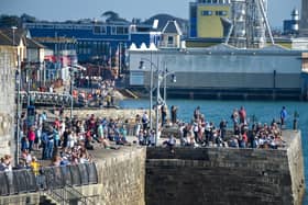 Crowds watch as HMS Queen Elizabeth departs from the Naval base on September 21, 2020 in Portsmouth. Picture: Finnbarr Webster/Getty Images