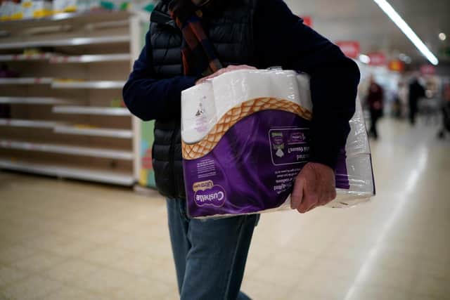 Shopper carrying toilet roll. Picture: Christopher Furlong/Getty Images
