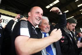 Pompey boss Paul Cook and chairman Iain McInnes celebrate promotion at Notts County in April 2017.