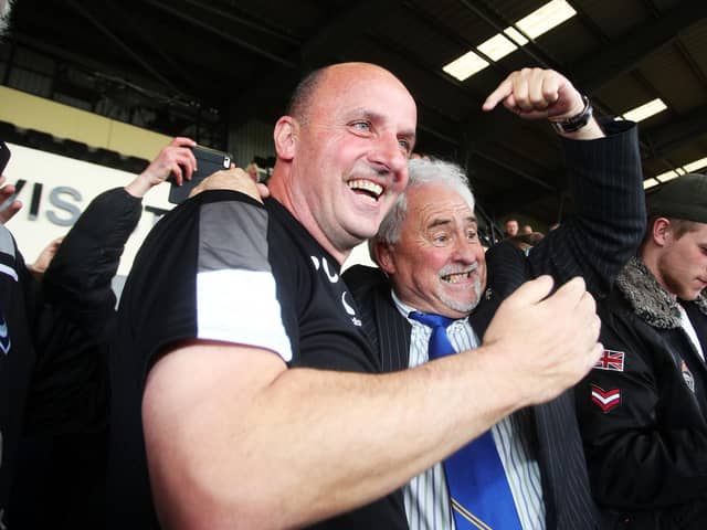 Pompey boss Paul Cook and chairman Iain McInnes celebrate promotion at Notts County in April 2017.
