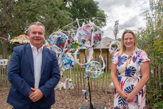 An image of the Leader of Hampshire County Council, Councillor Rob Humby (left) and Deputy Leader and Executive Lead Member for Children's Services, Councillor Roz Chadd with one of the Climate Unity project artworks
Picture credit: Hampshire County Council