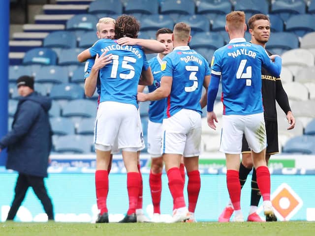 Pompey celebrate their win over MK Dons. Picture: Joe Pepler