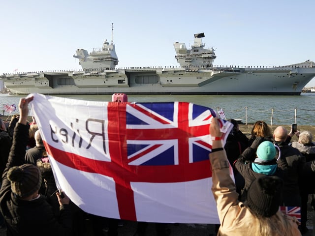 Friends and family of members of crew welcome back the Royal Navy aircraft carrier HMS Prince of Wales as it returns to Portsmouth Naval Base following a three-month deployment to the Eastern Seaboard of the United States, where the Prince of Wales has been undergoing trials and operating with aircraft and drones. Picture: Andrew Matthews/PA Wire