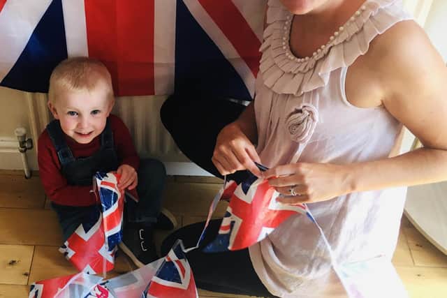 Ashley Billinghurst with her baby ahead of their VE Day celebration in Fareham.