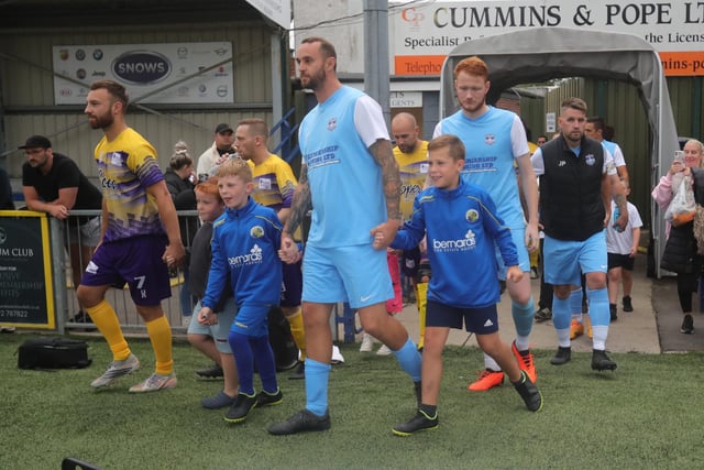 Players coming onto the pitch.
