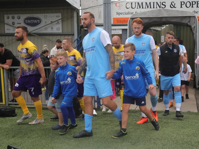 Players coming onto the pitch.