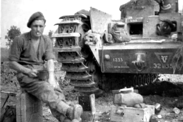 Corporal Ron Cross with his Churchill Tank AVRE on the July 13 1944 at Tailleville 
Photo: Malcolm Wells ( 041981-73 )