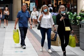 The mandatory wearing of face coverings in enclosed public spaces comes into force today.

Photo: Adrian Dennis/AFP via Getty Images