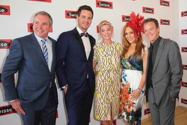Margot Robbie (C) poses with former Neighbours actors Alan Fletcher, Totti Goldsmith, Stefan Dennis and Dan OConnor. Picture: Scott Barbour/Getty Images