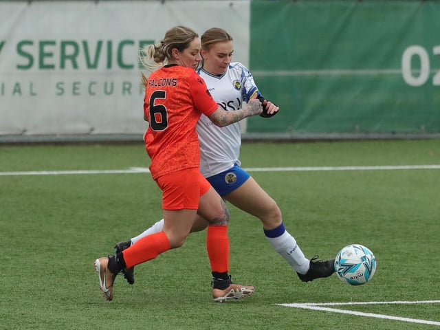 Hawks' Emma Davis tussles with Gosport Falcons' Amy Cooke. Picture: Dave Haines