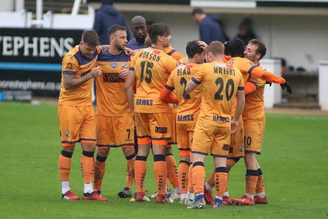 Hawks celebrate Roarie Deacon's goal in their 3-0 FA Cup win at Bath City. Picture: Kieron Louloudis