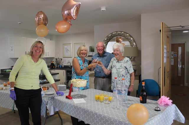 Shilling Place's House Manager, Gail Close, with residents of Shilling Place as they celebrate its first birthday