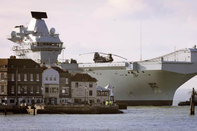 HMS Queen Elizabeth passes the Spice Island 27th February 2018. Picture: LPhot Sean Gascoigne/Royal Navy